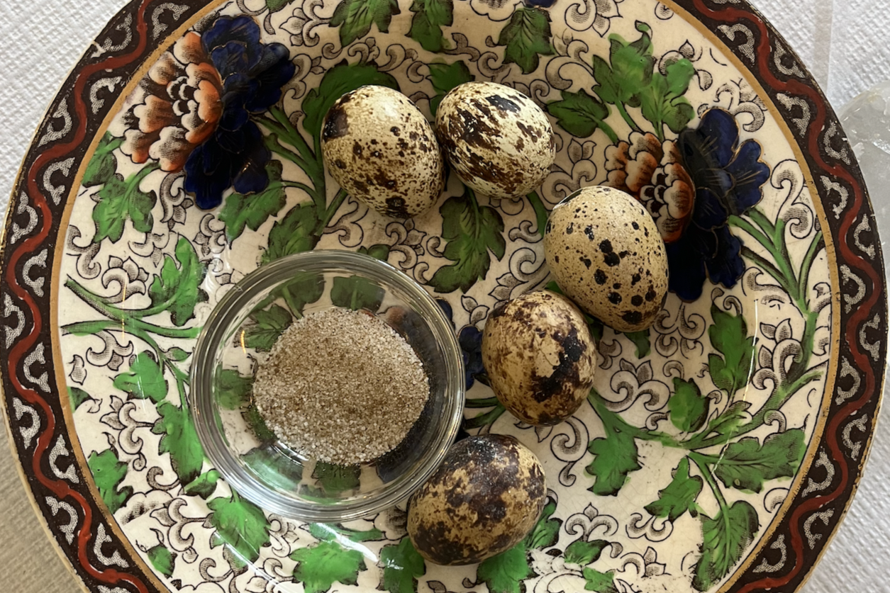 Speckled quail eggs with a dish of celery salt on a patterned plate at 101 Bridport, Bridport